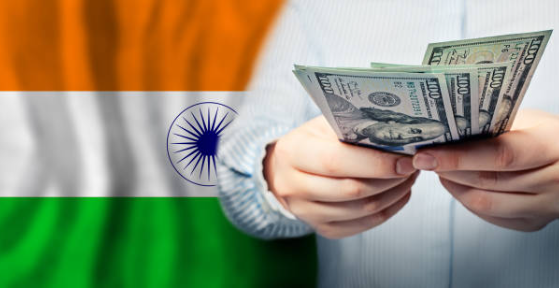 Indian Flag and US dollars in hands.